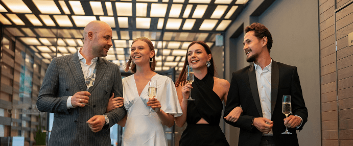 Attendees in business attire at a reception
